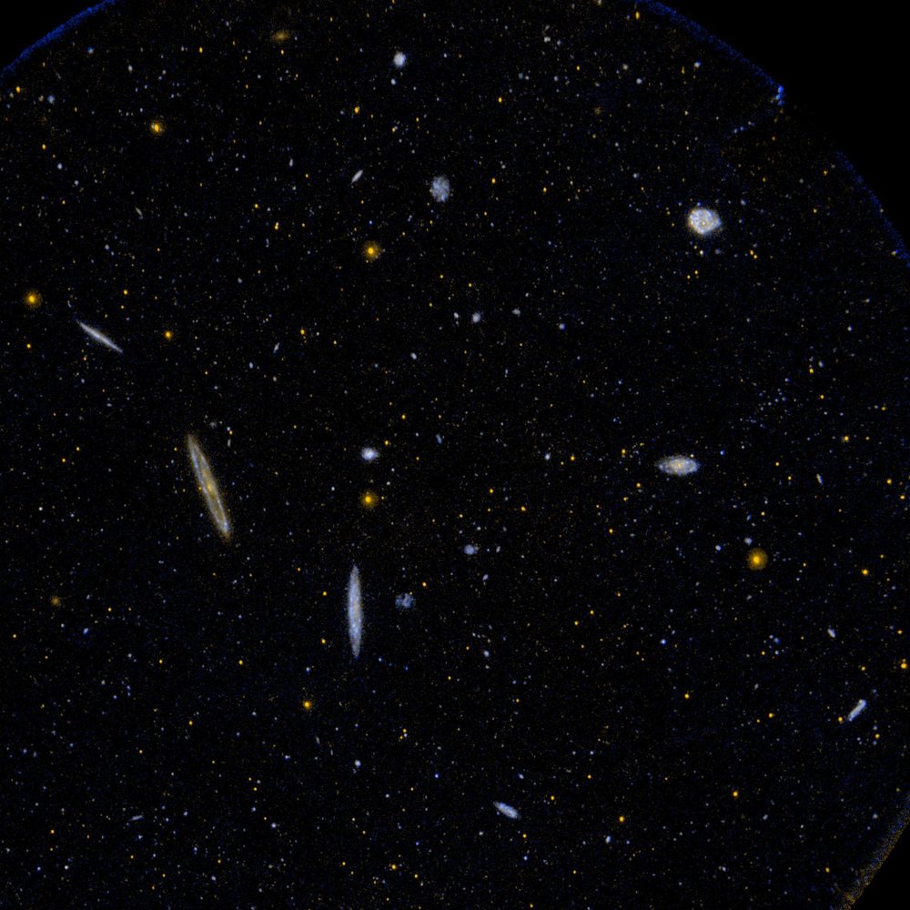 Real NASA Spitzer Space Telescope photo of galaxies in the Virgo Cluster, which lies within the Virgo constellation's boundaries